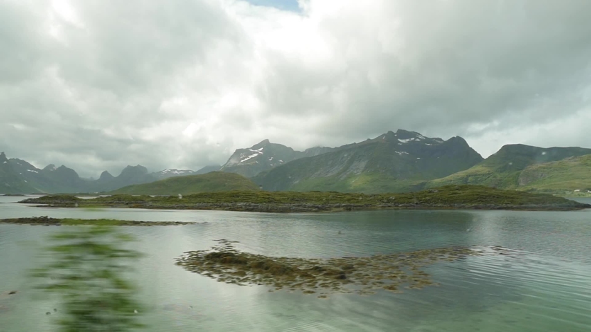 Slow Motion: Filmed from boat. Footage of Beautiful Norway Landscape with summer and sea!