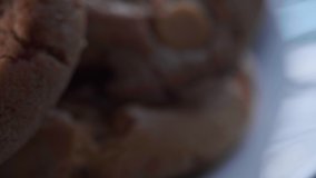 Close up footage of home made brown chocolate cookies.  Selective focus. racking shot.