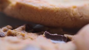 Close up footage of home made brown chocolate cookies.  Selective focus. Panning to the right.