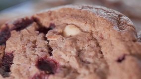 Close up footage of home made brown chocolate cookies.  Selective focus. Panning to the right.