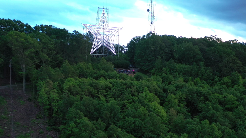 Drone flying by a star on top of mountain