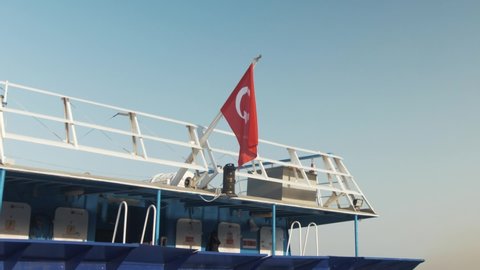 Mytilene, Greece - 08 15 2018: Turkish flag on stern of ferry