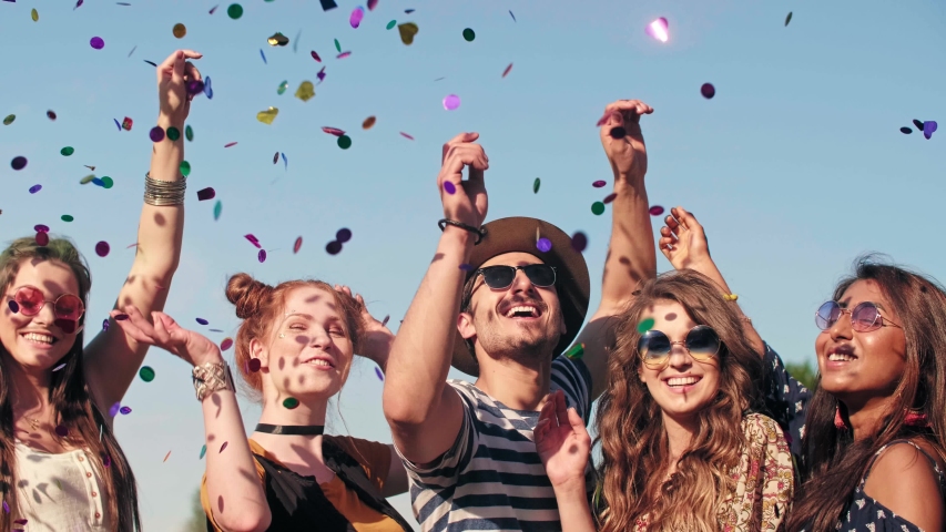 Group of friends dancing in confetti  Royalty-Free Stock Footage #1030935875