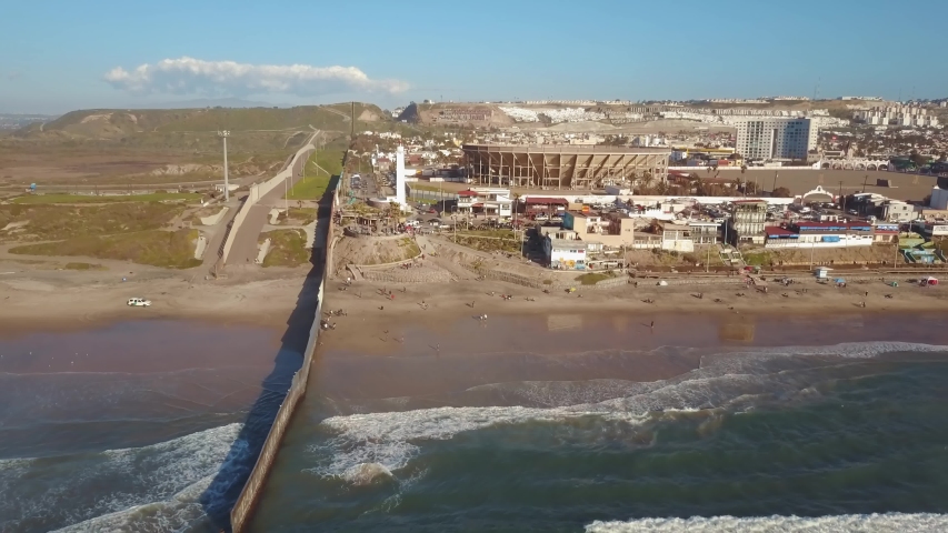 Aerial Flyover, Border Wall Separating Tijuana Mexico And The United States of America.