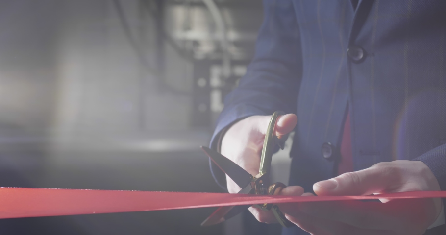 Close up of businessman cutting red ribbon with pair of scissors Royalty-Free Stock Footage #1030942661