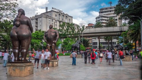 Medellin, Colombia - November 6: Time lapse view of Botero Square (Plaza Botero) showing people and outdoor sculptures by renowned Colombian artist Fernando Botero in Downtown Medellin, Colombia.