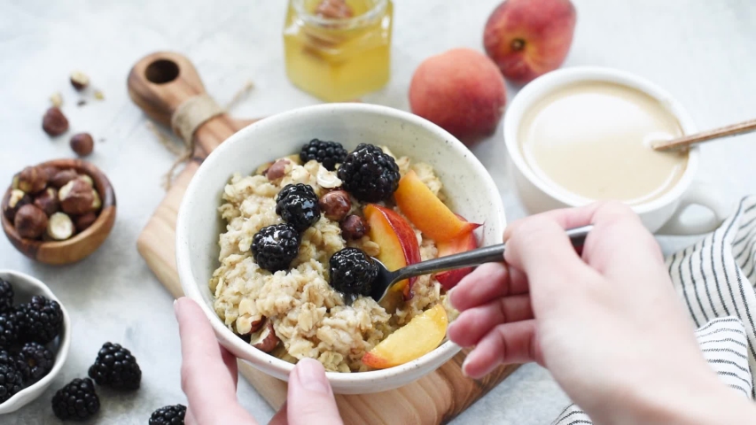 Person Eating Oatmeal Porridge with Stock Footage Video (100% Royalty ...