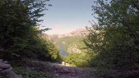 Video of zip line and person passing by over Cetina river in Croatia.