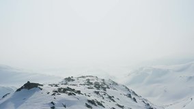 Aerial footage of Jotunheimen in Norway. Some fog over the mountains creating a moody atmosphere. Filmed in 4k