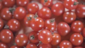 Close up footage of cherry tomatoes. Selective focus. Tilt down shot.