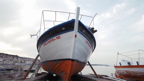 Mytilene, Greece - 12 13 2018: Wide shot carvel built Greek fishing boat