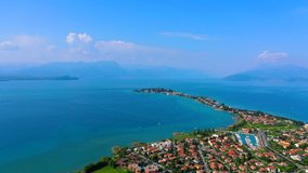Flying on drone early in the morning, aerial view of in Sirmione. Lake Garda. Italy.