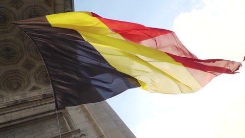 Belgium flag against tricolour stripes waving on wind from Arcade du Cinquantenaire 1920X1080 HD footage (1080p 100fps FullHD video)