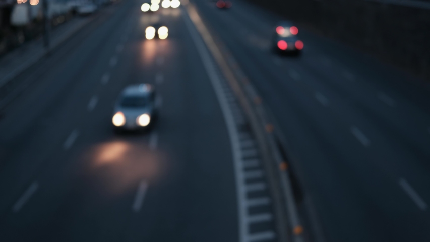 night city lights and traffic lights in Asia,  defocused. Colorful blurred bokeh of moving transport and city lights in busy business district.