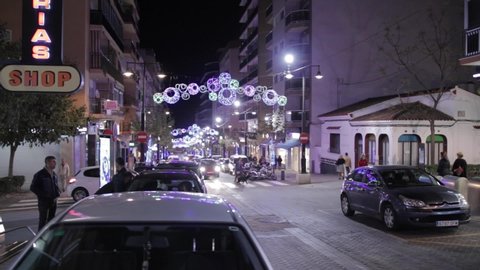 Calpe, Spain - 12 08 2018: Car driving by on a Christmas decorated street in Calpe Costa Blanca