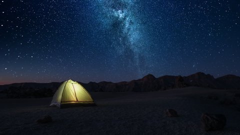Time-lapse Overnight Stay in a Tourist Tent on a Starry Night High in the Mountains before Dawn