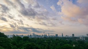 4K Time lapse of cloudy sunrise over downtown Kuala Lumpur, Malaysia. 