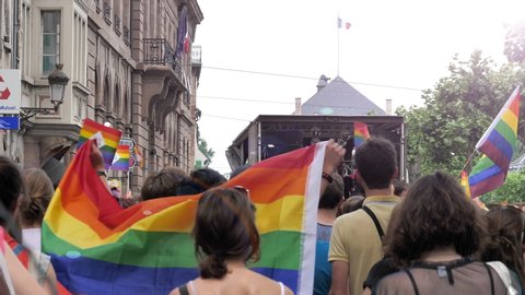 Strasbourg, France - Jun 8, 2019: People dancing happy following gay truck at annual LGBT GLBT visibility march pride FestiGays in central Strasbourg