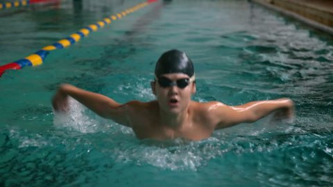 Young swimmer performing the butterfly stroke