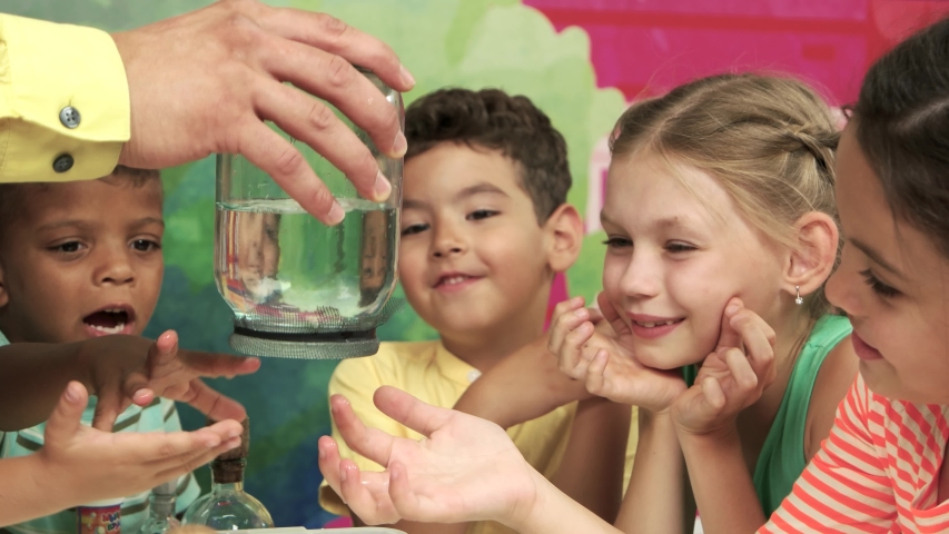 Water science experiment. Happy children in entertainment center. DIY science projects for kids. - Powered by Shutterstock - Get 15% off with code: PIKWIZARD15