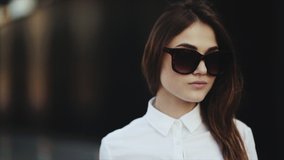 Close up. Business woman with luggage after tiring flight. Portrait of attractive young woman smiling at beach removes sunglasses cool. Attractive blonde young girl with big full lips smiling and - Powered by Shutterstock - Get 15% off with code: PIKWIZARD15