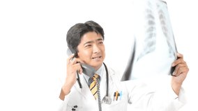 Asian medical doctor talking on the phone.
