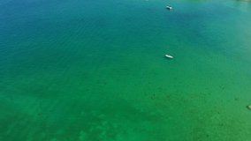 Aerial video with drone, boat on water, Lake Garda, Italy.