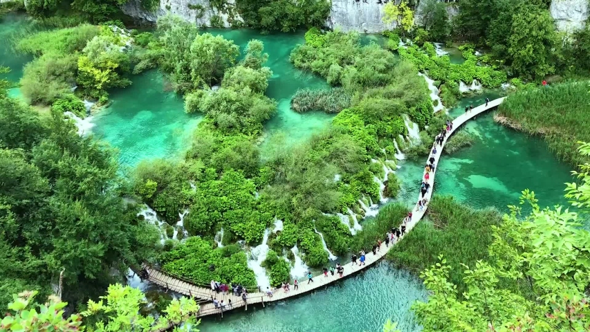 Blue water lakes. People walking in national park.