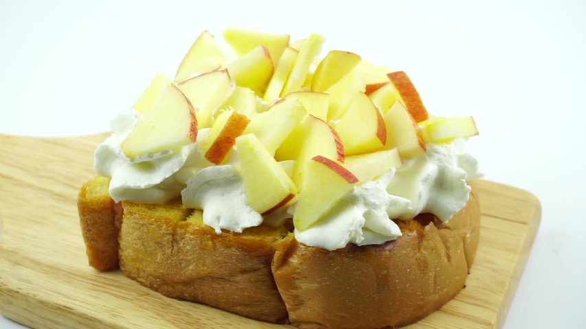 Honey toast topped whip cream Apple fruit in plate on white background, Food concept.