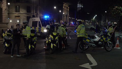 London, United Kingdom (UK) - 11 05 2018: Unit of motorcycle police guard a cordon during a suspect package incident