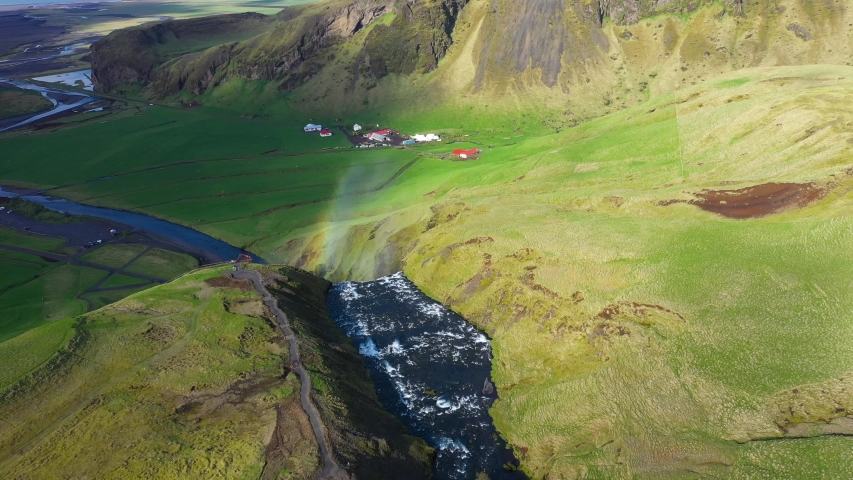 Aerial drone view of a rainbow over the Skogafoss waterfall in Iceland