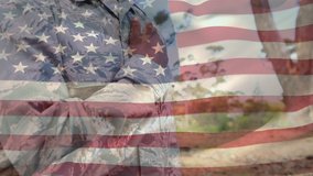 Digital composite of an African american soldier at attention with his hand on his chest with a flag waving in the foreground - Powered by Shutterstock - Get 15% off with code: PIKWIZARD15