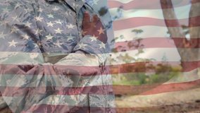 Digital composite of an African american soldier with his hand on his chest with a flag waving in the foreground - Powered by Shutterstock - Get 15% off with code: PIKWIZARD15