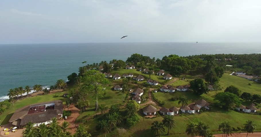 Overview of the aerial of a beach resort in Mermaids Bay in San Pedro Ivory Coast in Southwest Africa Royalty-Free Stock Footage #1031102177