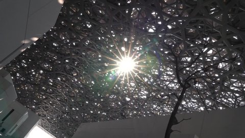 Abu Dhabi, United Arab Emirates - 05 27 2019: Sunlight penetrating the ceiling of Louvre Abu Dhabi United Arab Emirate