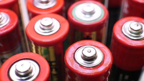 Different types of used batteries in heap
