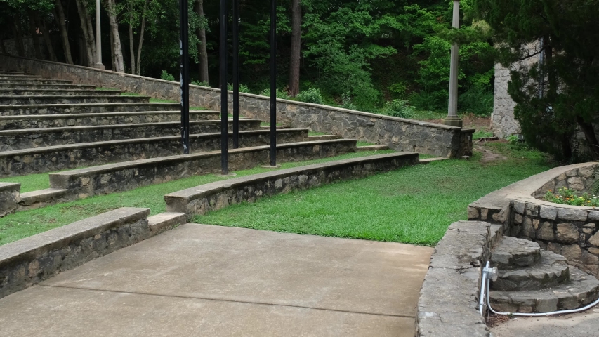 Classically styled outdoor theater with stone amphitheater style seating in Raleigh, North Carolina where movies and stage productions are performed.