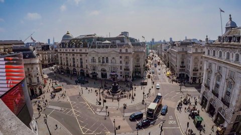 London, London / United Kingdom (UK) - 11 04 2018: Time-lapse of traffic and tourists at Piccadilly Circus