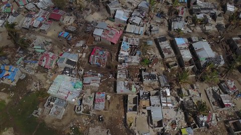 Aerial Drone fly over Temporary camps in Praia Nova, Beira, Mozambique a fishing village neighborhood - Cyclone Idai caused severe flooding and damaged for houses and infrastructures.  