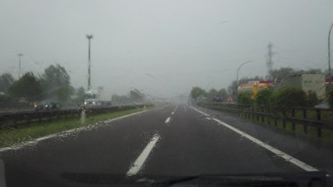 Mantova, Italy. June 7, 2019. Driving on Italian highway with heavy rain. Driving shot, driver point of view