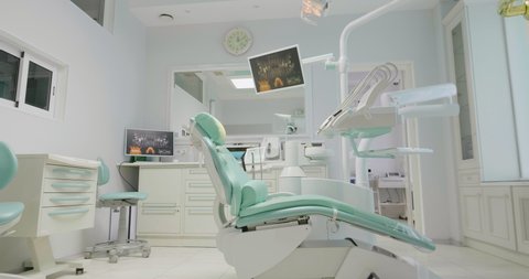 Colorful interior of dentistry office with chair and tools.