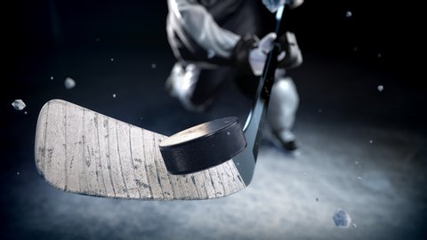 Hockey player in black uniform hits the puck in slow motion. Beautiful close-up (4k, 3840x2160, ultra high definition)