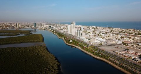 Ras al Khaimah corniche with mangroves aerial view sunrise