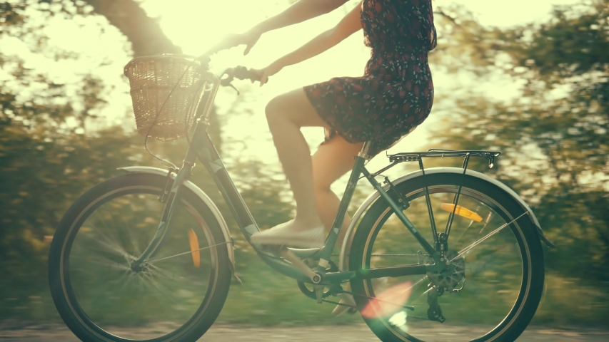 Cyclist Girl Workout Riding Bike Summer. Cycling In Sunset City Park Recreation.Pretty Lady Sport Recreation Bicycle. Happy Girl Relaxing.Cyclist Woman Have Fun.Fit Woman In Dress Bike Holiday Cycling | Shutterstock HD Video #1031175752