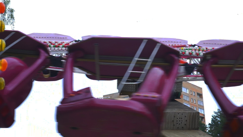Rotating carousel in an amusement park.