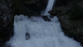Aerial drone footage view of Cascate in Dolomites /Waterfall  , Natural Park in Dolomites in Italy // no video editing
