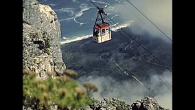 close up of cable car ascending the Table Mountain NP cableway. Historical ARCHIVAL FOOTAGE in Cape Town city of South Africa in 1980s.