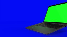 4K Video. Laptop Turning On With green Screen On A blue Background.
