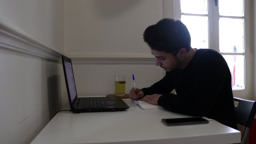 Young adult studying for exams at home, time lapse.