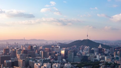 Seoul city skyline and Seoul tower modern building and architecture, Beautiful clouds flow through the Seoul tower in the morning in downtown Seoul, South Korea. 4k timelapse